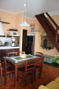 a kitchen and dining room with a table and chairs at Casa EUROPA in Cavallino-Treporti