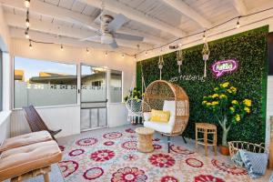 a living room with a large wall with flowers at Oak Scottsdale - BOHO Scottsdale Oasis Getaway-Pool-Hottub-ZenRoom in Scottsdale