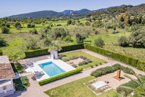 an aerial view of a garden with a swimming pool at Casa Blanca in El Port de la Selva