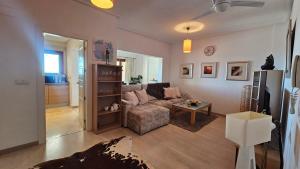 a living room with a couch and a table at Beautiful 2 bed apartment at El Valle Golf AA412EV in Murcia