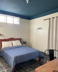 Cama ou camas em um quarto em A Casa Azul