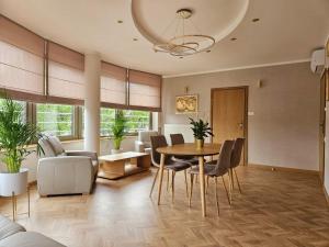 a dining room with a table and chairs at Restauracja Hotel Przystan in Lublin