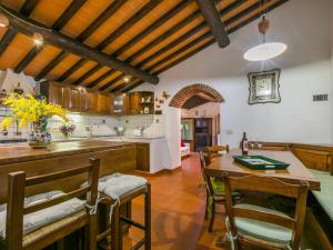 a kitchen and dining room with a table and chairs at Apartment Padronale by Interhome in Greve in Chianti