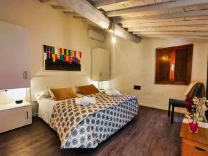 a bedroom with a bed in a room at Loft 47 in Siena