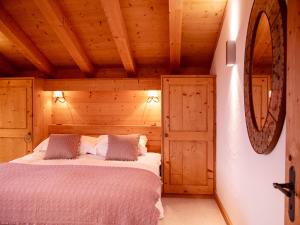 a bedroom with a bed in a wooden cabin at Chalet Chalet Olivier by Interhome in Villars-sur-Ollon