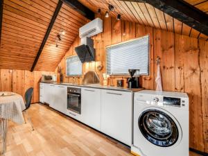 a kitchen with a washer and dryer at Holiday Home Tjana - all inclusive - 6km from the sea by Interhome in Esbjerg