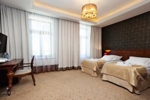 Posteľ alebo postele v izbe v ubytovaní Hotel Akvilon + 35 fotografií