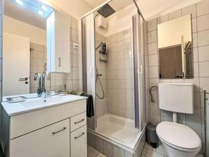 a bathroom with a toilet sink and a shower at Apartment Appartement Wolf by Interhome in Sankt Urban