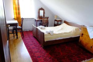 Cama o camas de una habitación en Dworek Łukowiska