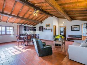 a living room with a couch and a table at Apartment Antico Frantoio by Interhome in Greve in Chianti