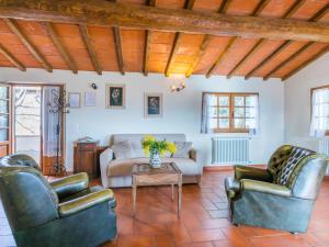 a living room with two couches and a table at Apartment Antico Frantoio by Interhome in Greve in Chianti