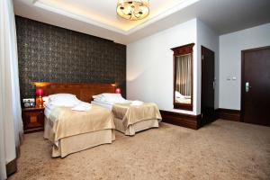 Posteľ alebo postele v izbe v ubytovaní Hotel Akvilon