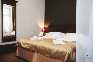 Posteľ alebo postele v izbe v ubytovaní Hotel Akvilon