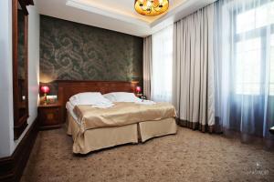 Posteľ alebo postele v izbe v ubytovaní Hotel Akvilon