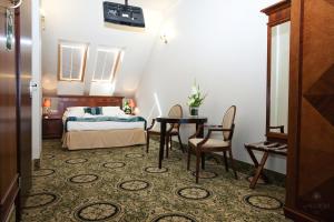 Posteľ alebo postele v izbe v ubytovaní Hotel Akvilon