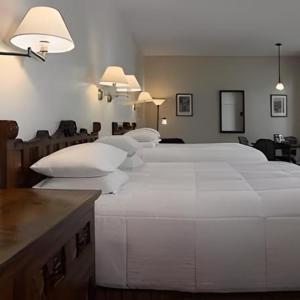 a bedroom with a large white bed in a room at La Tourelle Hotel & Spa in Ithaca