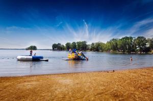 a group of people on a raft in the water at 3 Bedroom Cottage Dragon Fly Drive 7 in Cherry Valley