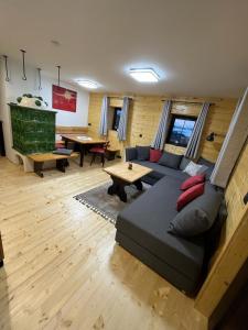 a living room with a couch and a table at Apartment Martin in Sonnenalpe Nassfeld