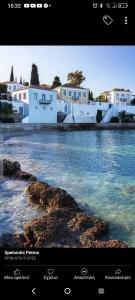 a picture of a river with houses and buildings at Villa Santa Marina in Spetses