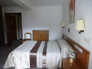 Postel nebo postele na pokoji v ubytování Hostal Palas