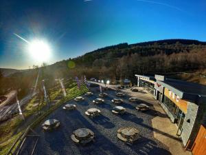 a group of cars parked in a parking lot next to a building at Westwood Drive in Treharris
