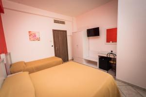 TV a/nebo společenská místnost v ubytování Hotel Baia Verde