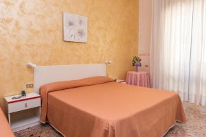Postel nebo postele na pokoji v ubytování Hotel Baia Verde
