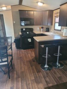 a kitchen with a stove and a counter top at 3 Bedroom Cottage Beachview Lane 35 in Cherry Valley
