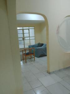 a living room with a couch and a table at Casa Central em Petrolina in Petrolina