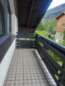 a balcony with a view of the mountains at Na Brzegu in Szczyrk
