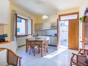 a kitchen with a table and chairs in a room at Holiday Home La Casa del Ponte Romano by Interhome in Bucine