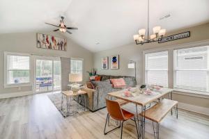 a living room with a table and a couch at New Tucked Away Quiet Beach Haven in Little River