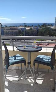 Balkon lub taras w obiekcie Palm Garden Apartment