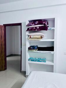Ένα ή περισσότερα κρεβάτια σε δωμάτιο στο CM homestay