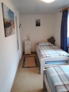 Postel nebo postele na pokoji v ubytování Ferienwohnung Carstens