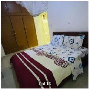 a bedroom with a bed with pillows on it at Home sweet home in Kigali