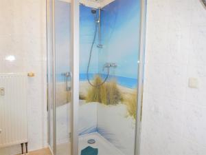 a bathroom with a shower with a view of the beach at Komfortferienwohnung Kreideblick in Sassnitz