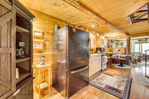een keuken met een grote roestvrijstalen koelkast bij Rustic Searsport Cabin Loft and Sunroom on 10 Acres in Searsport
