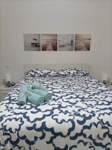 a bed with a blue toy car on it at The Garden House alla Scala dei Turchi in Realmonte +63 photos
