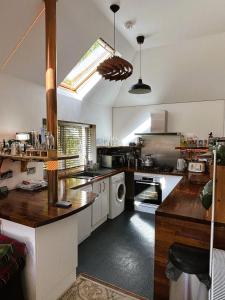 a kitchen with a sink and a stove top oven at North Lodge Kilmun in Kilmun