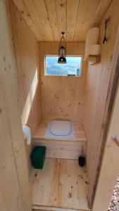 a small wooden sauna with a toilet in it at Schäferhütte in Krispl