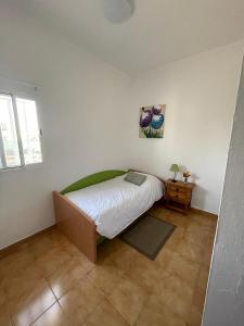 a bedroom with a bed and a table in it at Casa Don Daniel, Arona in Buzanada