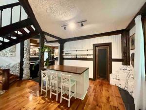 a kitchen with a table and chairs in a room at Nature Retreat w/ Sunroom Gazebo in Cantley
