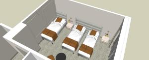 a hospital room with two beds and a mirror at Ośrodek Szkoleniowo Wypoczynkowy Galicya in Krynica Zdrój