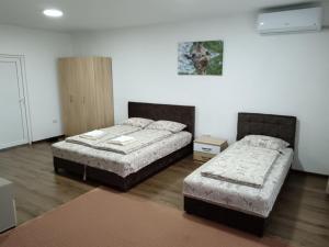 Apartmani Centar 객실 침대