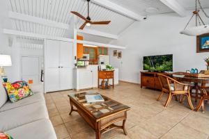 a living room with a couch and a table at "Makani Moana" at Keauhou Resort #104, Entire townhome close to Kona in Kailua-Kona