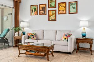 a living room with a couch and a table at "Makani Moana" at Keauhou Resort #104, Entire townhome close to Kona in Kailua-Kona