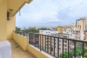 a balcony with a view of a city at Luna 2-BR in Mar Mikhael in Beirut