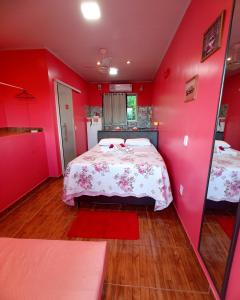 A bed or beds in a room at Pousada Linda Vista