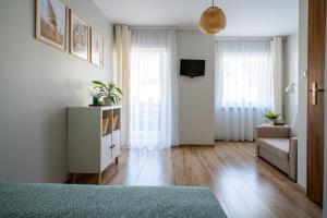 TV a/nebo společenská místnost v ubytování VERTUS